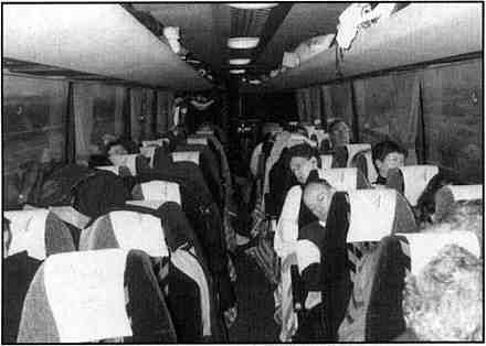 picture of the choir asleep on the tour bus