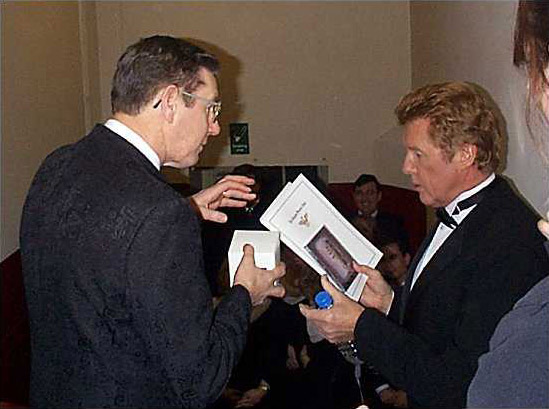 Michael Crawford takes time out to have his photograph taken with the members of the Glasgow Phoenix Choir